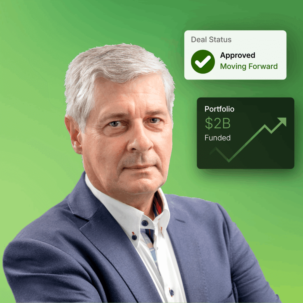Jerry Wieliczko standing beside an approval and a funding chart